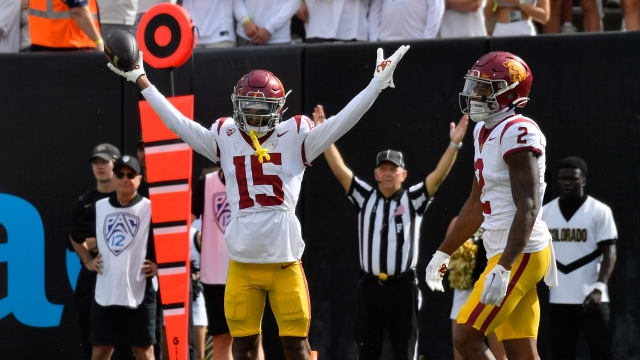 Sep 30, 2023; Boulder, Colorado, USA; USC Trojans wide receiver Dorian Singer (15) raises his ars after catching a pass for a touchdown in the second quarter against the Colorado Buffaloes at Folsom Field. Mandatory Credit: John Leyba-USA TODAY Sports